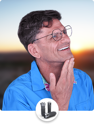 Smiling middle age patient who got dental implants in Los Algodone