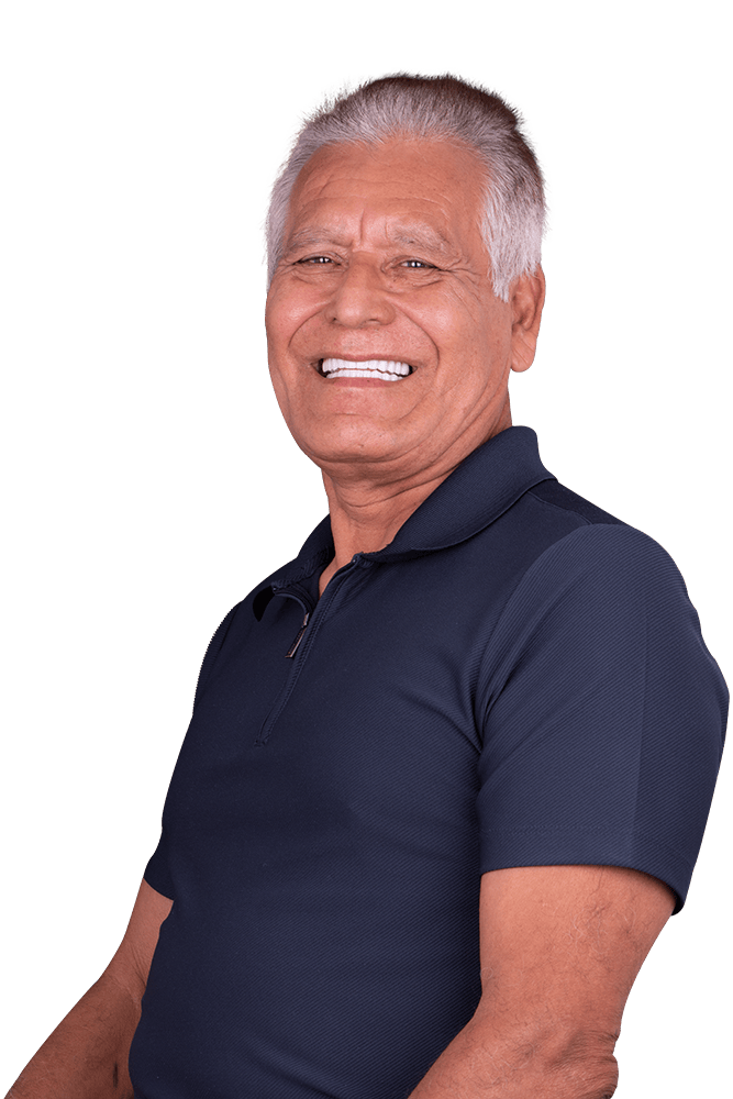 Young woman showing her full set of porcelain veneers done in Los Algodones, Mexico