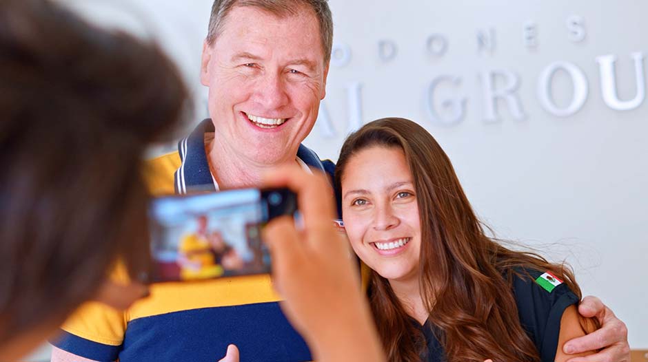 Young man smiling with a dentist in Molar City